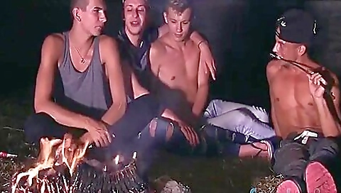 Tattooed brunette takes care of a wild outdoor orgy and gets boned