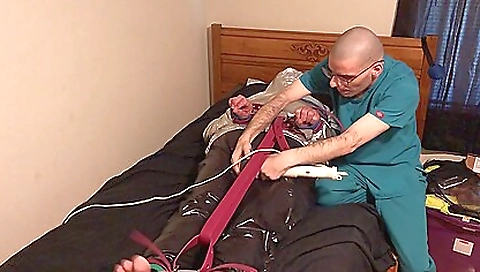 A rubber man is tied up and his breath is controlled by a nylon toy